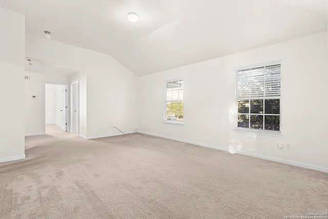 an empty room with windows