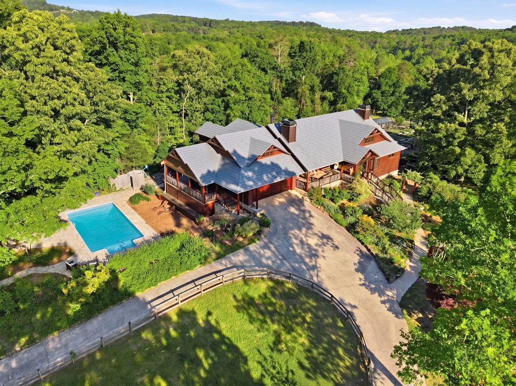 1823 Shoal Creek Road Clarkesville, GA 30523 - Photo 5 of 149 an aerial view of a house with a garden