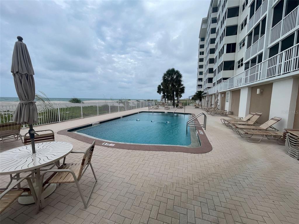 633 Alhambra Road, Unit 1006 Venice, FL 34285 - Photo 50 of 55 a view of a swimming pool with sitting area