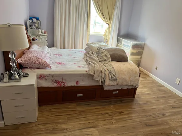 a bedroom with a bed and a dresser