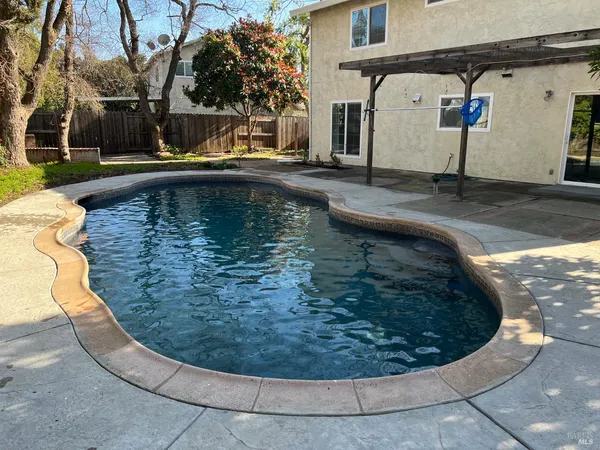 a view of a swimming pool with a sitting space