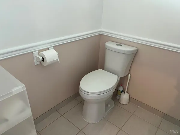 a bathroom with a toilet and a sink