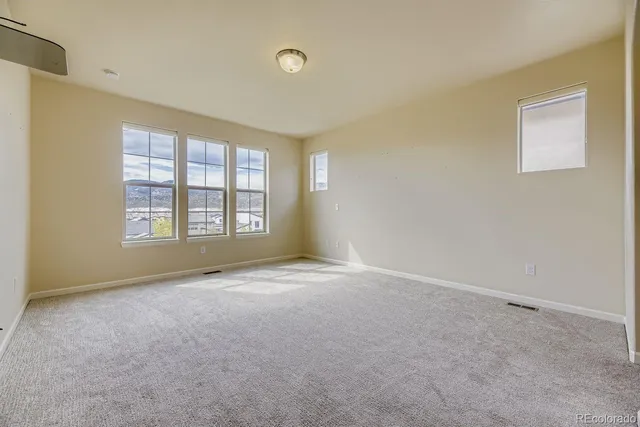 an empty room with windows