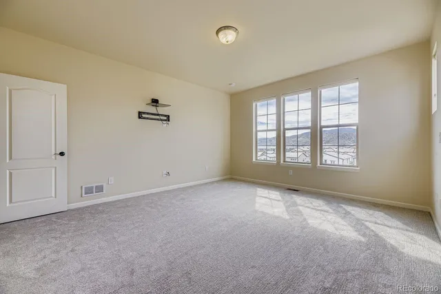 an empty room with windows