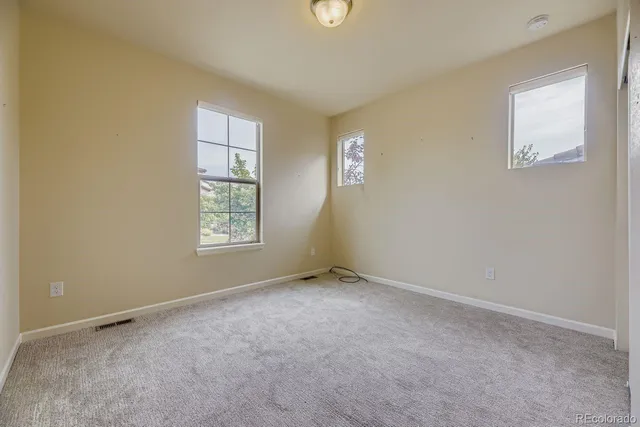 an empty room with windows