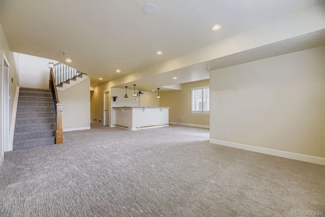 a view of a hallway with stairs