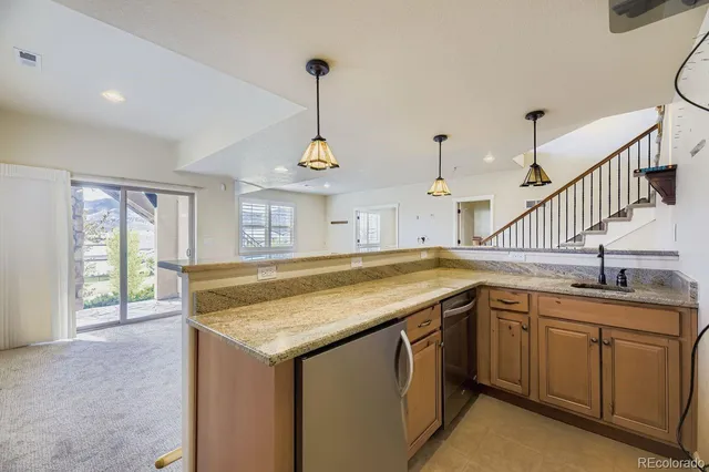 a kitchen with sink and window