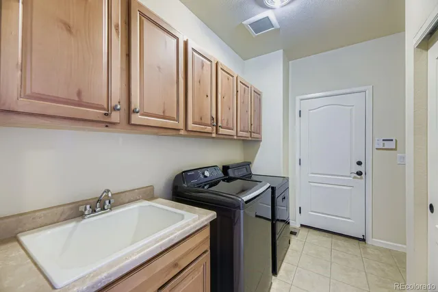 a bathroom with a sink and cabinets