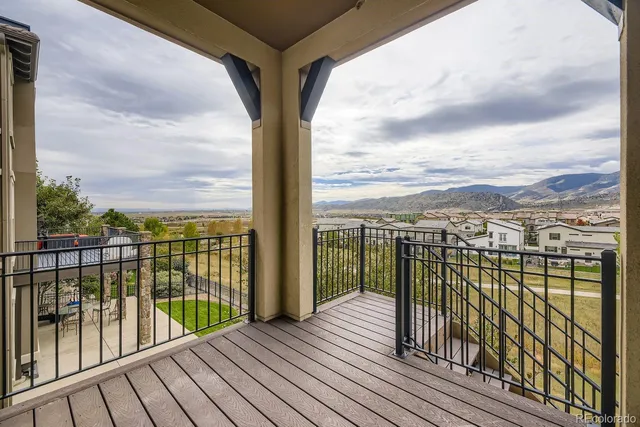 a view of a balcony with wooden floor