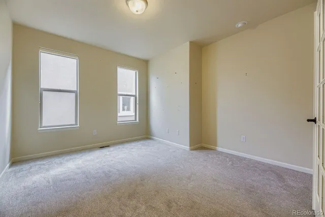 an empty room with windows