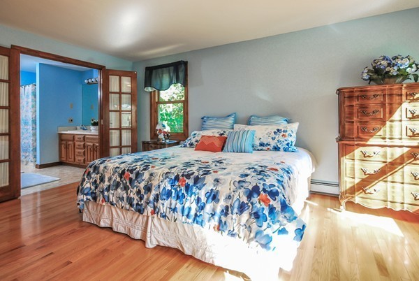 55 Captain Carltons Road Barnstable, MA 02635 - Photo 11 of 24 a bedroom with a large bed and a window