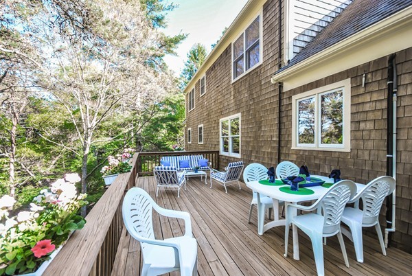 55 Captain Carltons Road Barnstable, MA 02635 - Photo 5 of 24 a view of a patio with table and chairs and potted plants
