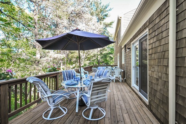 55 Captain Carltons Road Barnstable, MA 02635 - Photo 7 of 24 a view of balcony with wooden floor and outdoor seating