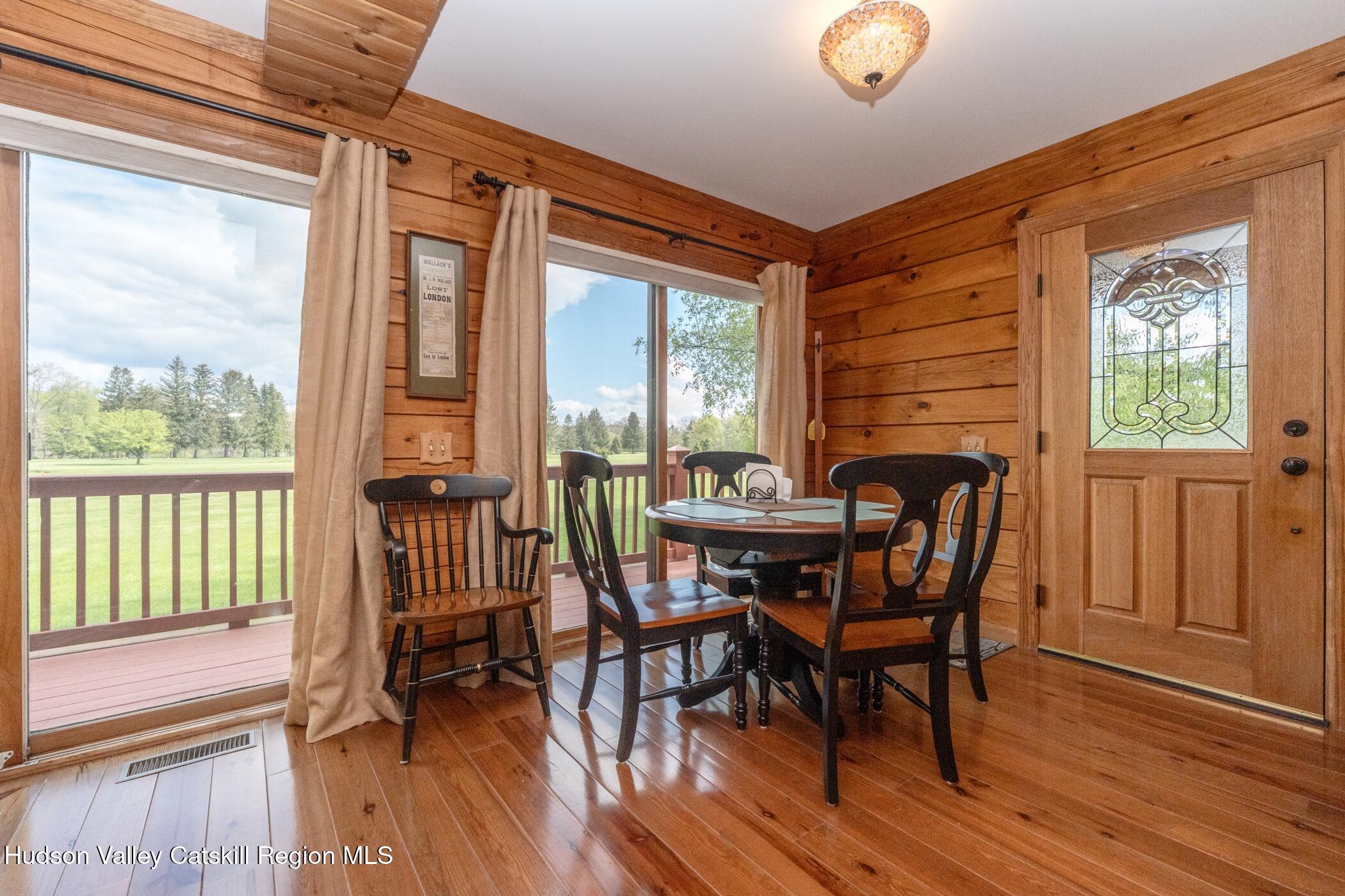 140 Stone Dock Road High Falls, NY 12440 - Photo 7 of 42 a view of a dining room with furniture and wooden floor