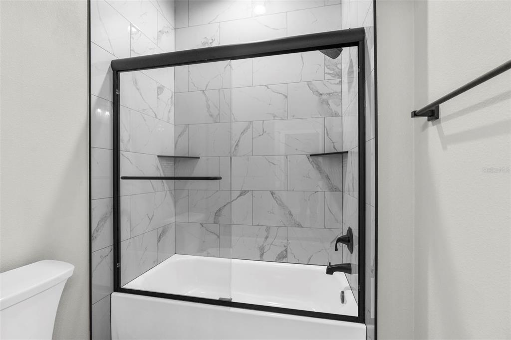 3 Lupine Street Homosassa, FL 34446 - Photo 12 of 44 a bathroom with a bathtub and a shower