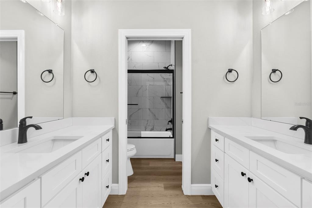 3 Lupine Street Homosassa, FL 34446 - Photo 13 of 44 a bathroom with a shower sink and mirror