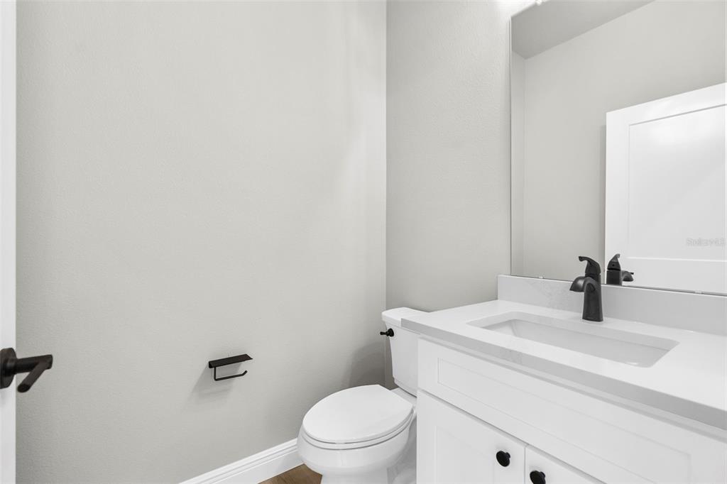 3 Lupine Street Homosassa, FL 34446 - Photo 20 of 44 a bathroom with a sink a toilet and mirror