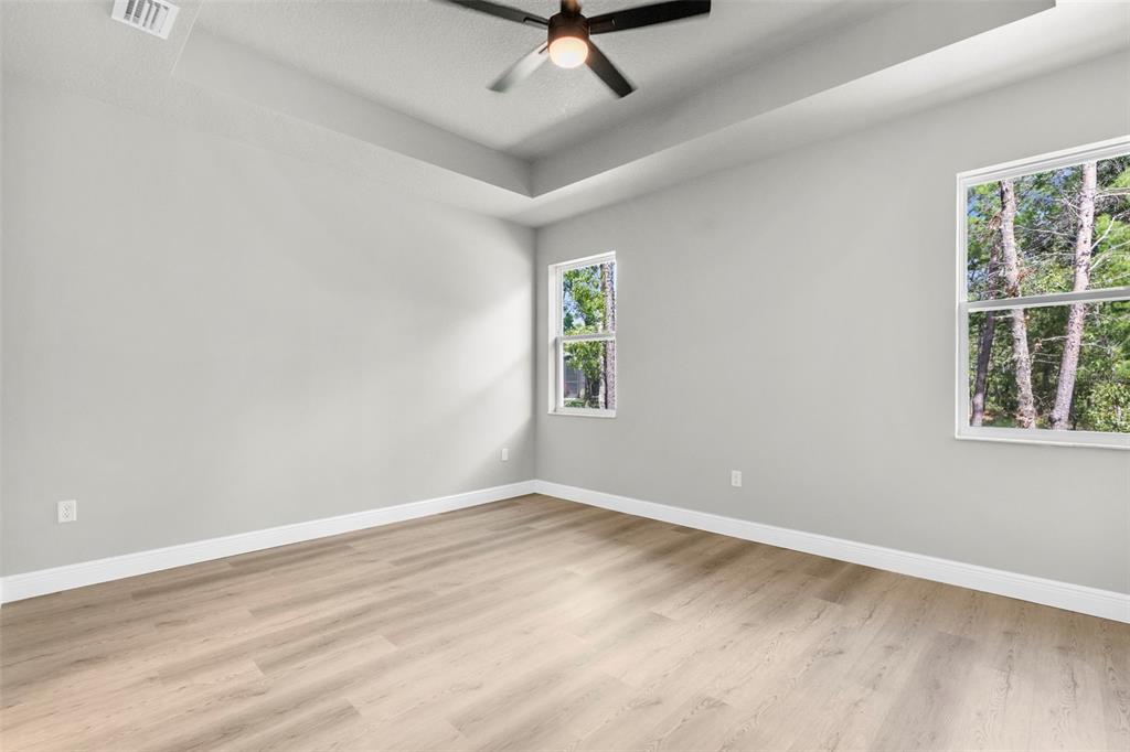 3 Lupine Street Homosassa, FL 34446 - Photo 21 of 44 a view of room with window and ceiling fan