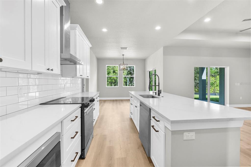 3 Lupine Street Homosassa, FL 34446 - Photo 10 of 44 a kitchen with a sink stove and cabinets