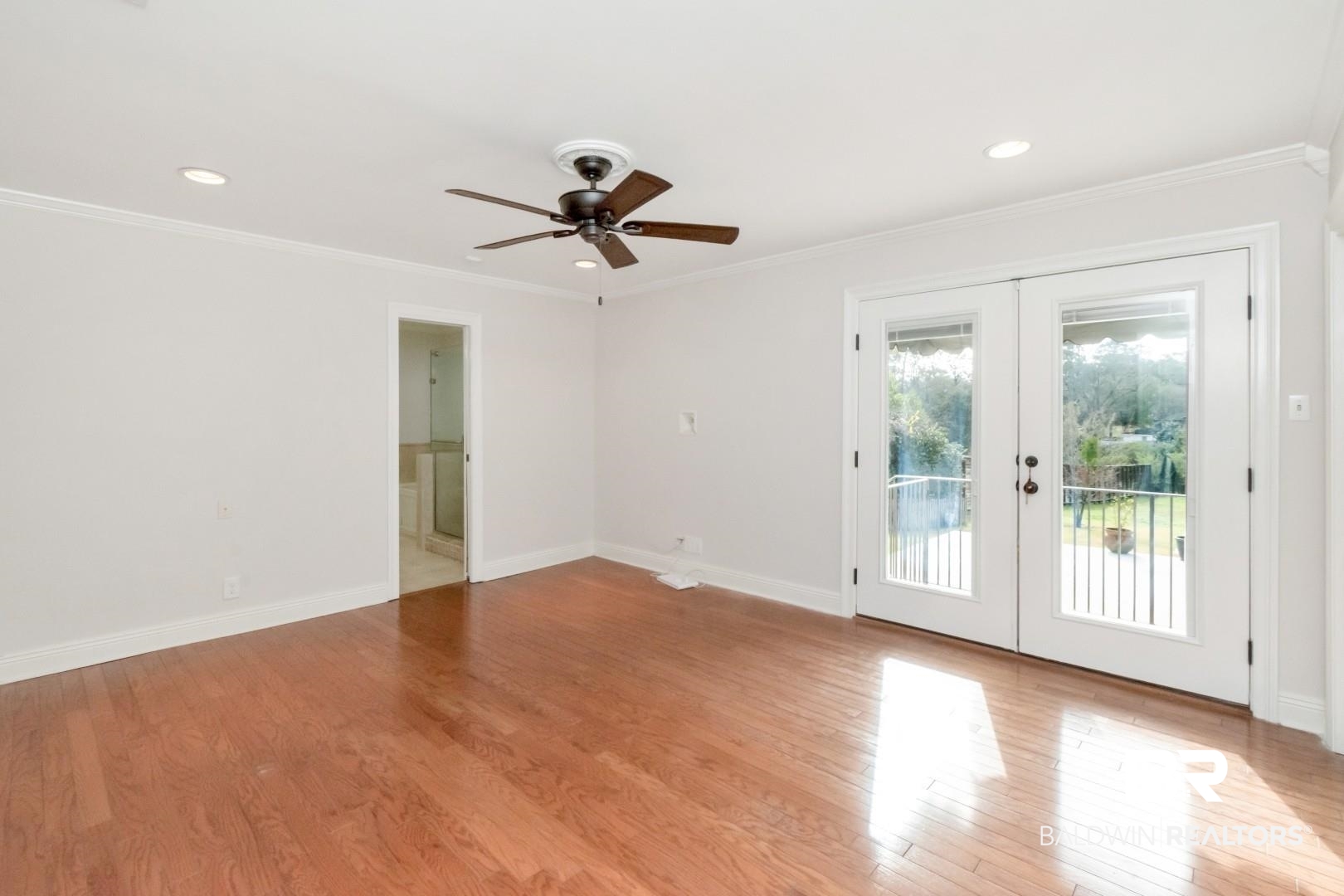 231 Rochester Road Mobile, AL 36608 - Photo 23 of 51 Unfurnished room with french doors, light wood finished floors, ceiling fan, ornamental molding, and recessed lighting