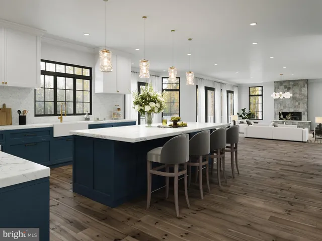 a large kitchen with a table and chairs
