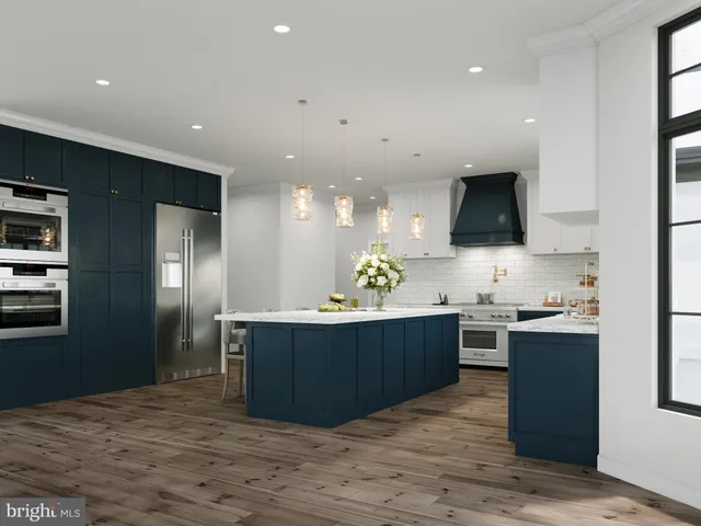 a kitchen with stainless steel appliances granite countertop a sink and a stove top oven