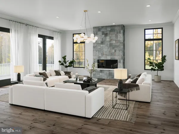 a living room with furniture wooden floor and a fireplace