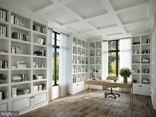 a living room with furniture and a book shelf