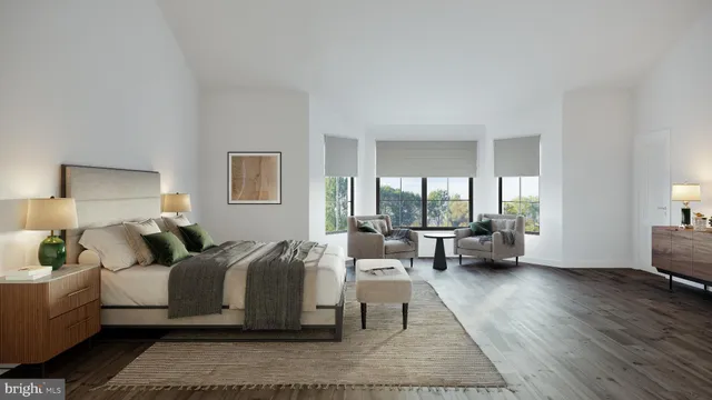 a bed room with two beds and a large window