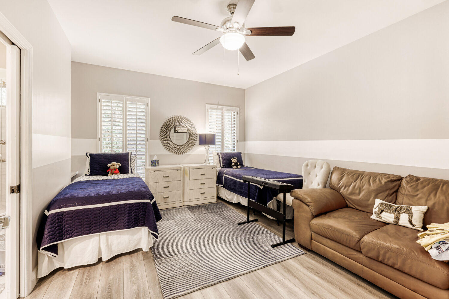 10273 St Andrews Road Boynton Beach, FL 33436 - Photo 19 of 28 a bedroom with furniture and a window