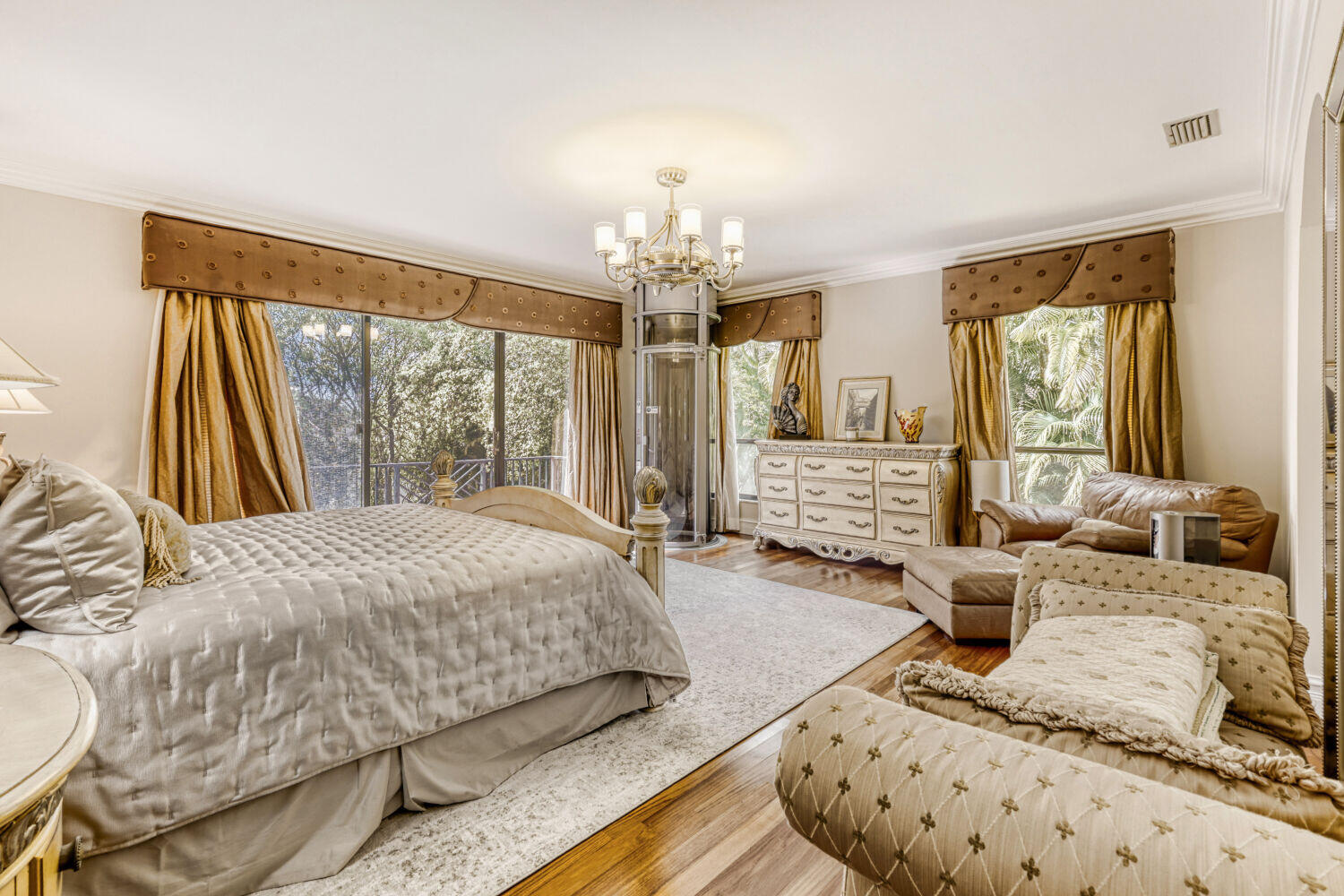 10273 St Andrews Road Boynton Beach, FL 33436 - Photo 20 of 28 a large bedroom with a bed and glass windows