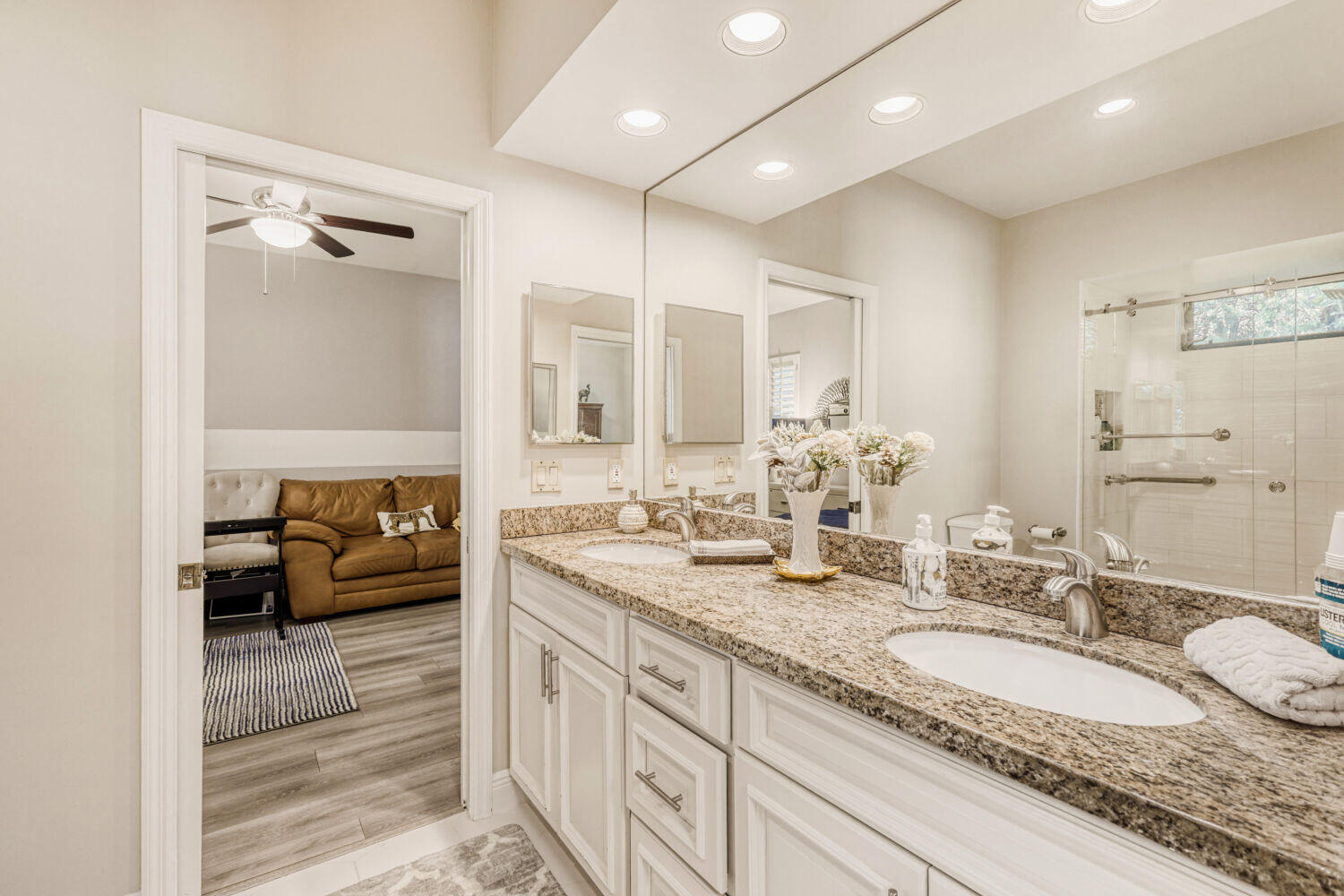 10273 St Andrews Road Boynton Beach, FL 33436 - Photo 22 of 28 a spacious bathroom with a granite countertop sink a mirror and a shower