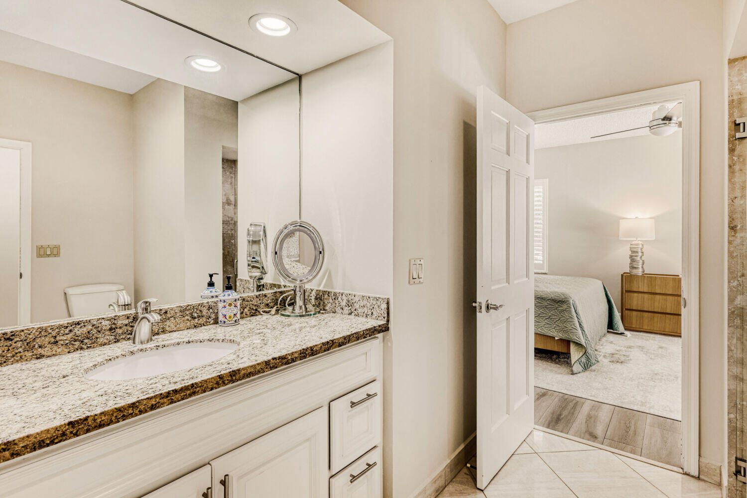 10273 St Andrews Road Boynton Beach, FL 33436 - Photo 26 of 28 a en suite bathroom with a granite countertop sink and a mirror