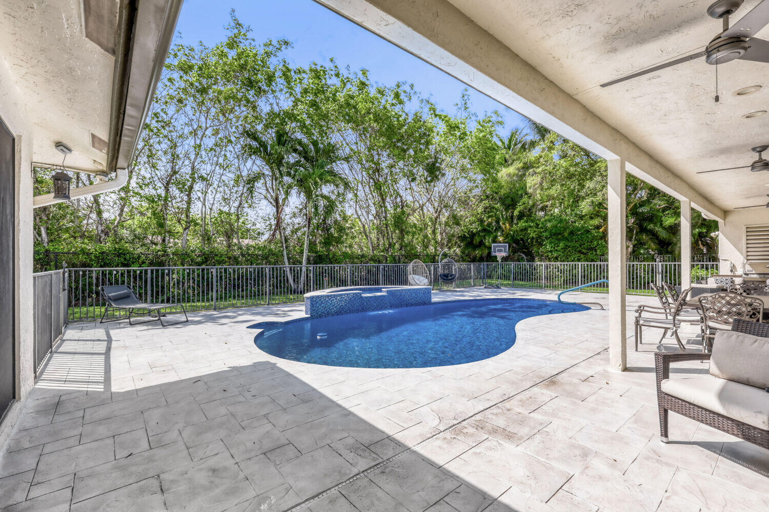 10273 St Andrews Road Boynton Beach, FL 33436 - Photo 27 of 28 a view of backyard with swimming pool and outdoor seating
