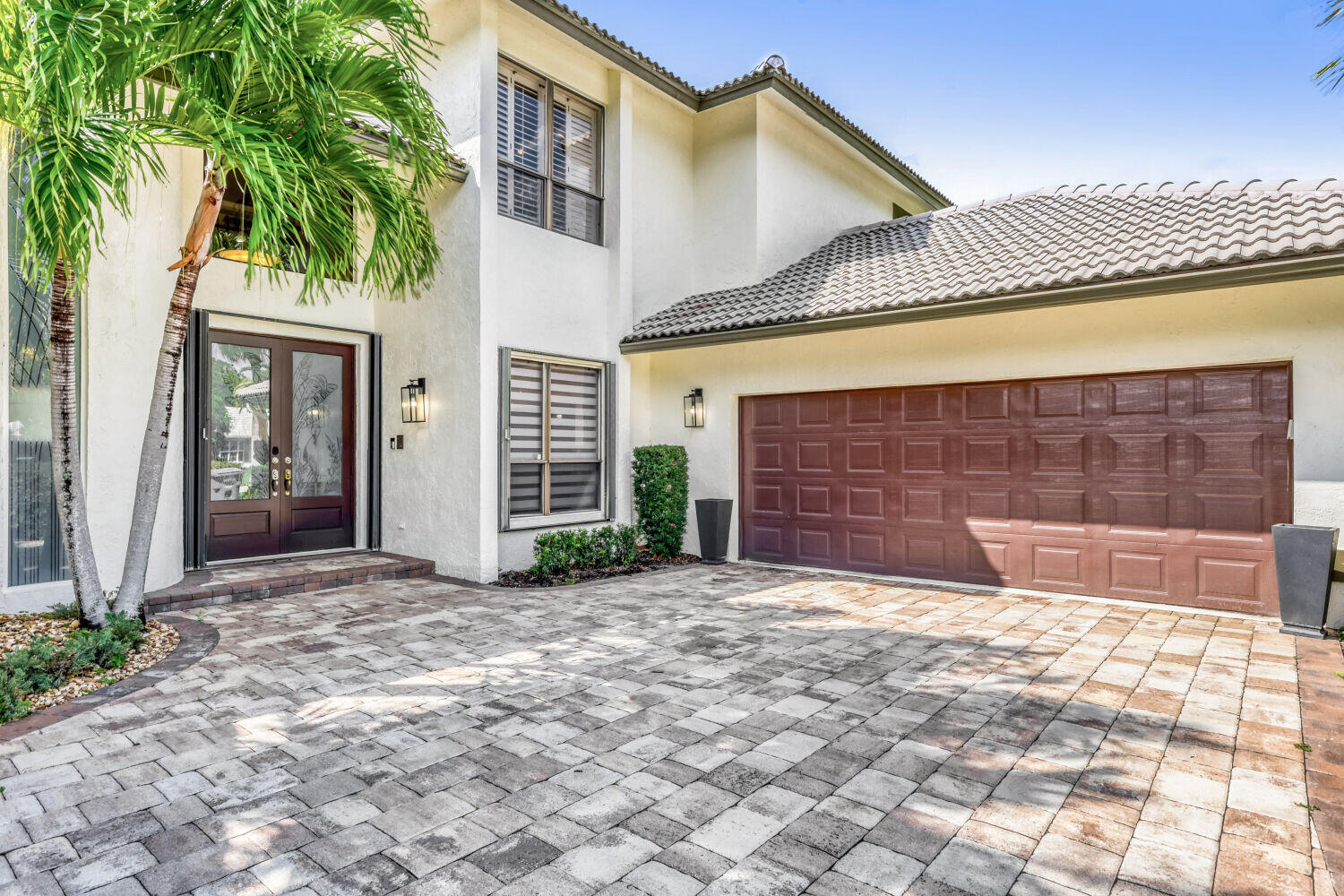10273 St Andrews Road Boynton Beach, FL 33436 - Photo 3 of 28 a view of a house with a patio and a yard