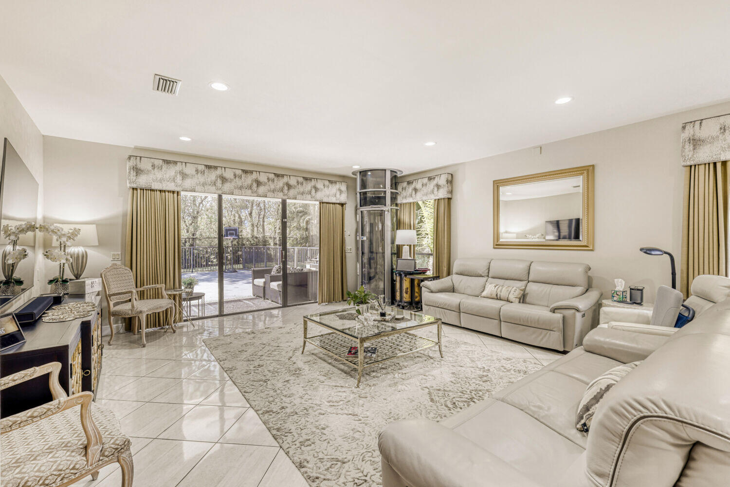 10273 St Andrews Road Boynton Beach, FL 33436 - Photo 6 of 28 a living room with furniture and a large window