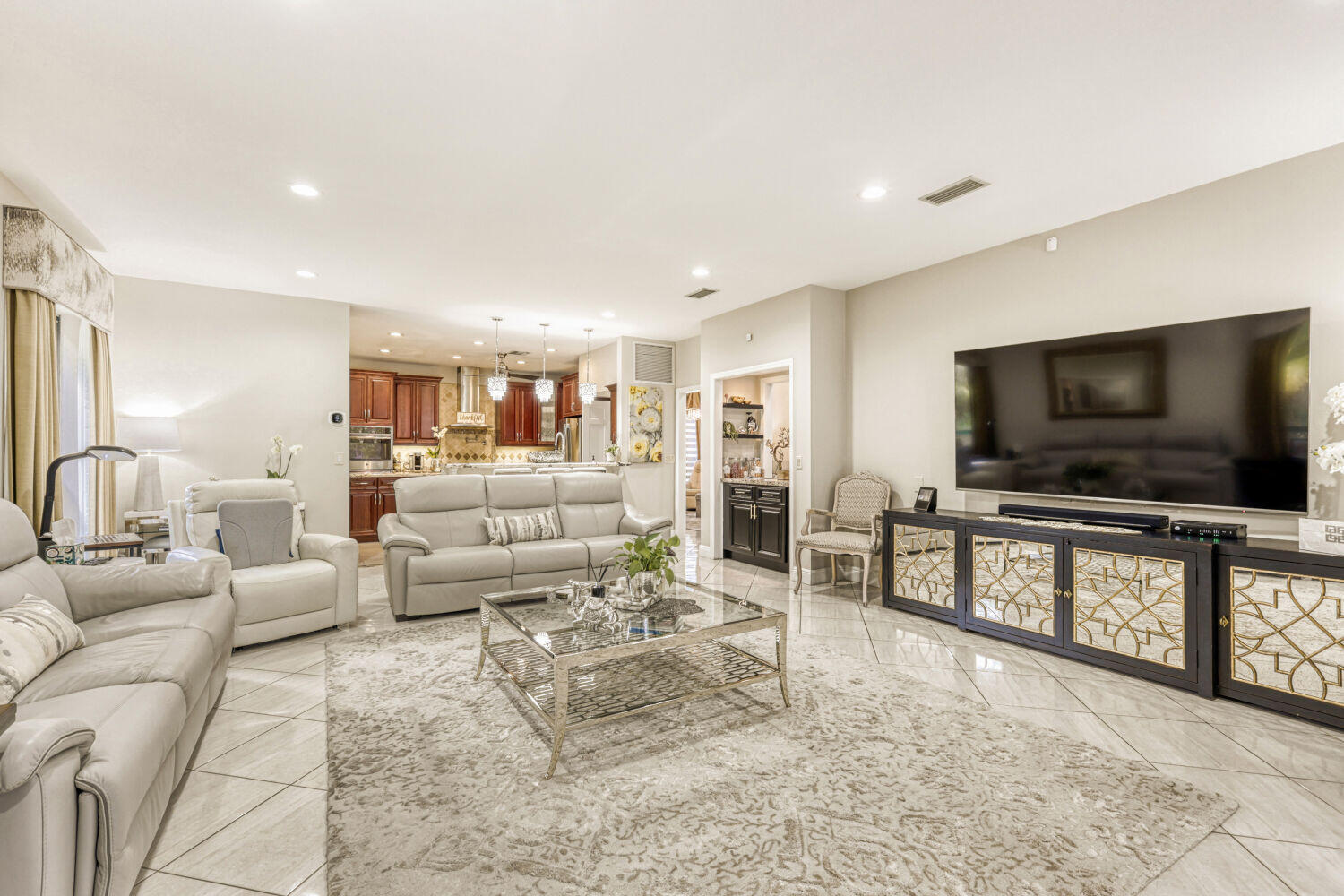 10273 St Andrews Road Boynton Beach, FL 33436 - Photo 7 of 28 a living room with furniture and a flat screen tv