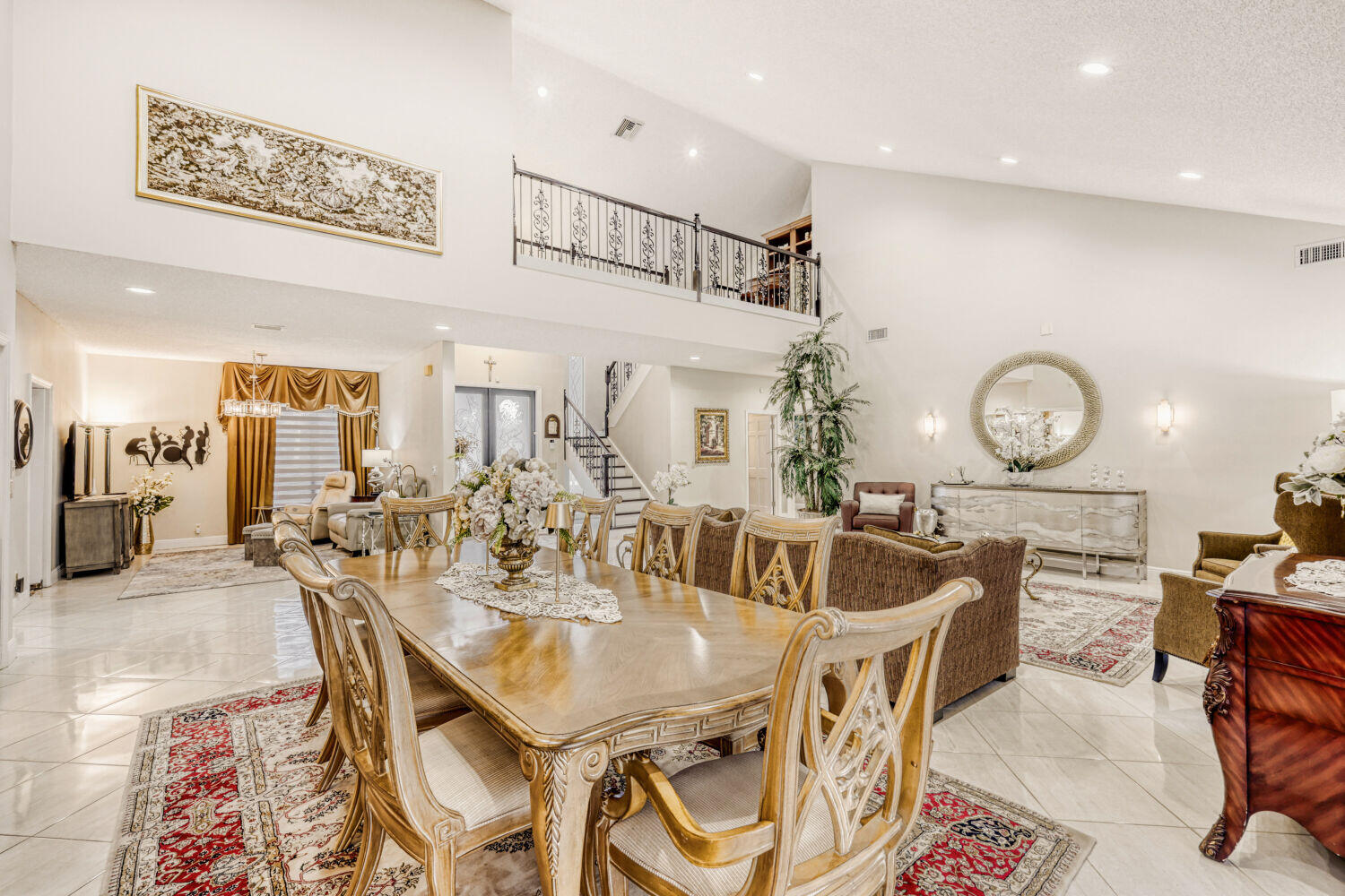 10273 St Andrews Road Boynton Beach, FL 33436 - Photo 10 of 28 a view of a dining room with furniture and a chandelier