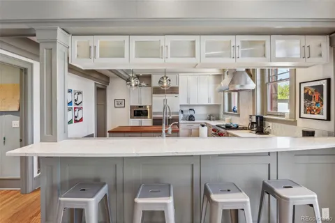a view of a kitchen with furniture and a window