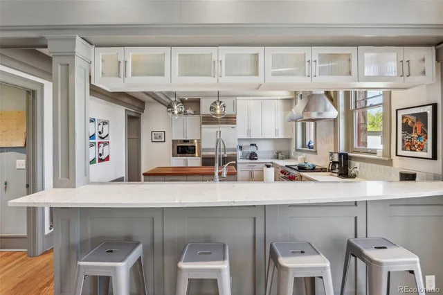 a view of a kitchen with furniture and a window