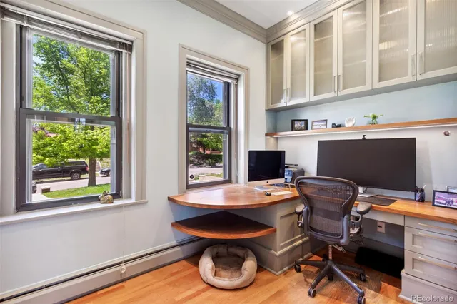 a workspace with furniture and a window