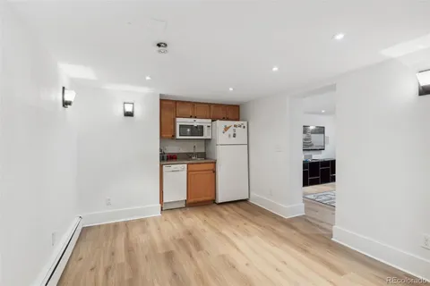 a kitchen with stainless steel appliances a refrigerator and a stove top oven