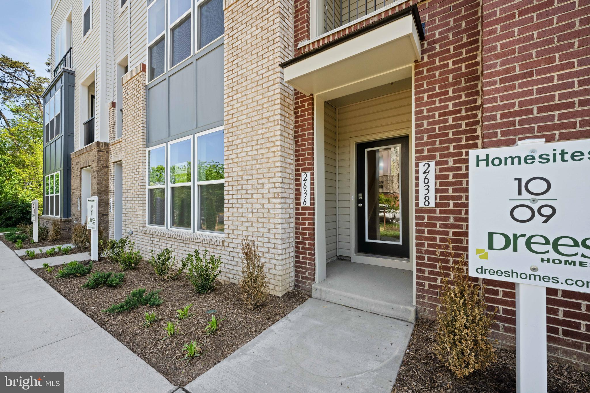a view of a brick house with a large windows