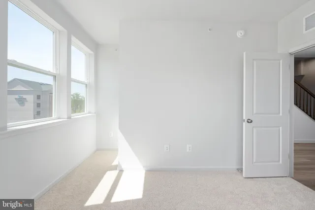 a bathroom with a double vanity sink a mirror and a shower
