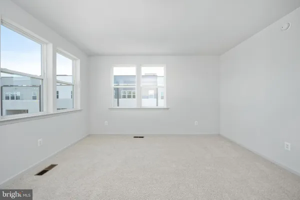 a spacious bathroom with a double vanity sink a mirror and shower