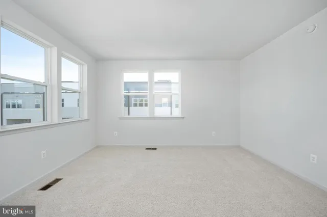 a spacious bathroom with a double vanity sink a mirror and shower