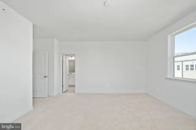 a bathroom with a shower and a sink