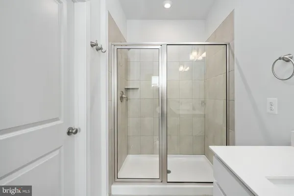 a bathroom with a sink double vanity and a mirror