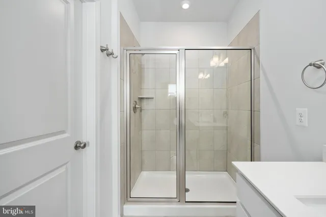 a bathroom with a sink double vanity and a mirror