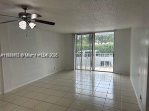 500 Executive Center Drive, Unit 1C West Palm Beach, FL 33401 - Photo 6 of 12 a view of an empty room with a window